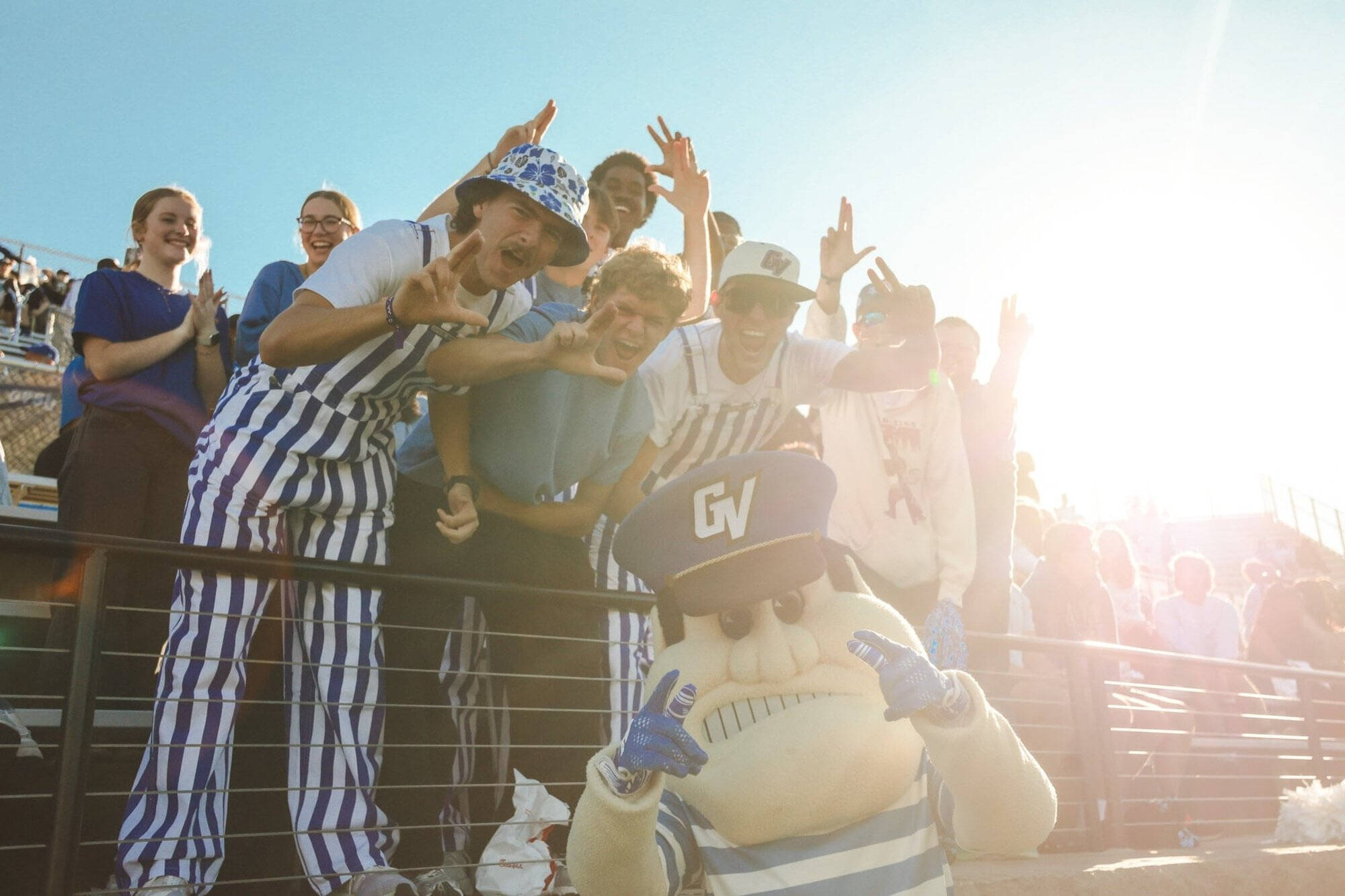 Group of people standing in bleachers